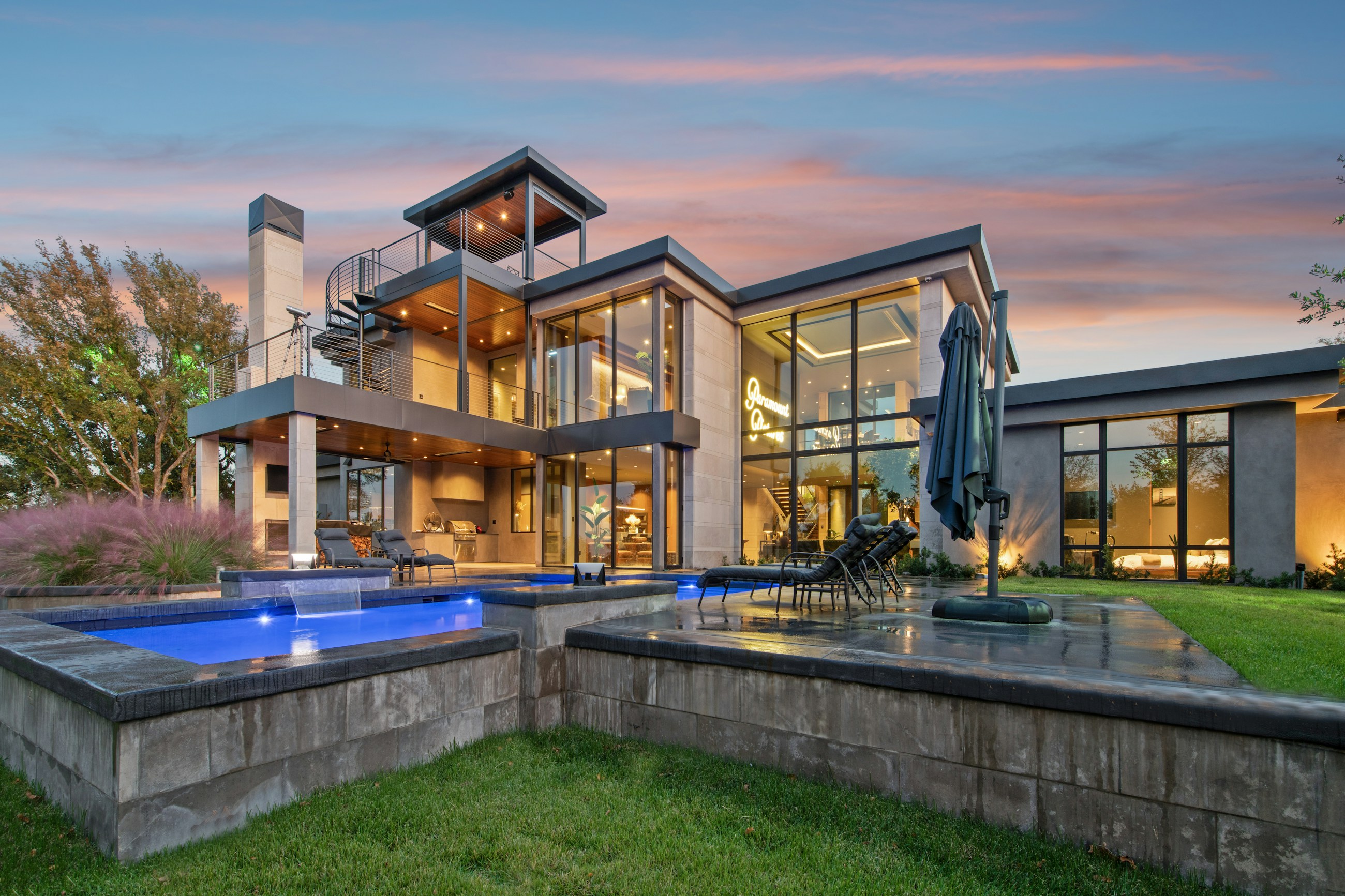 Contemporary luxury home with clean architectural lines and illuminated interiors