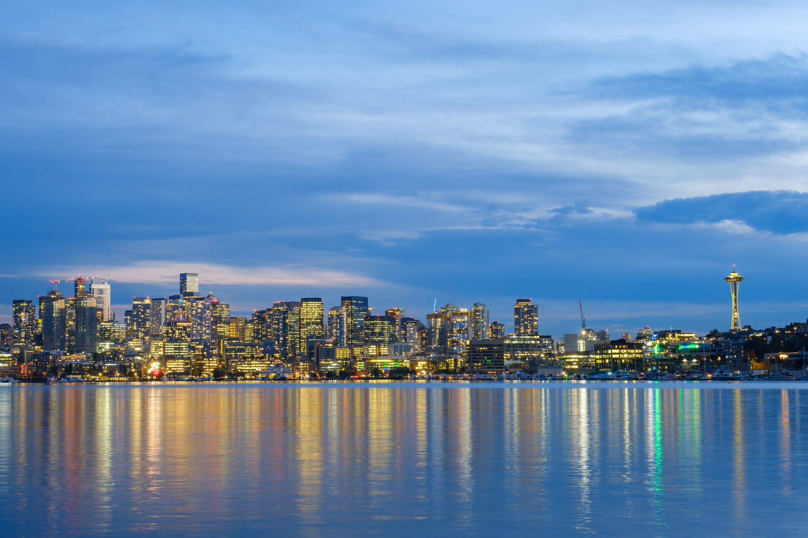 Seattle skyline and Space Needle across the water at dusk