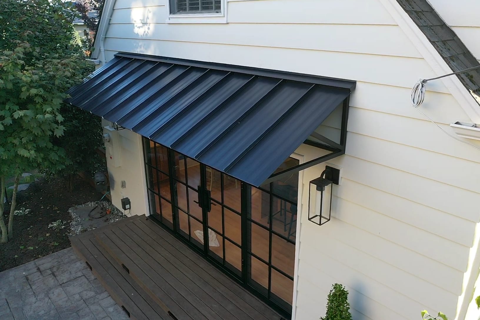 Metal roof detailing above a residential entry